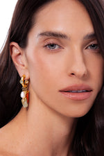Model wearing Alma green quartz gold-plated drop earrings with pearl and orange feldspar by Maria Dolores